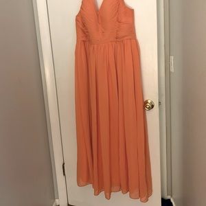 Orange floor length formal gown.